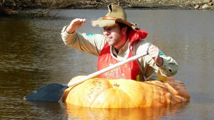 Adam isn't the only pumpkin paddler in our region. Tim paddled a pumpkin in the Collector Creek in the lead-up to the Collector Pumpkin Festival in 2013. Picture by Ben Roberts