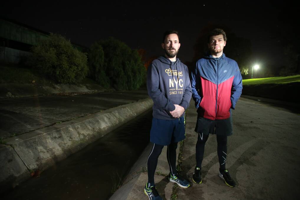 HEARTS OF GOLD: Jeff Norris and Ashley Rodgers rescued a man who fell into Bendigo Creek on Thursday night while walking his dog. Picture: GLENN DANIELS