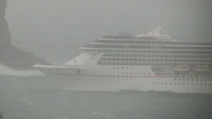 The Carnival Spirit going through the Heads during the storm on Wednesday. Photo: James Carrick