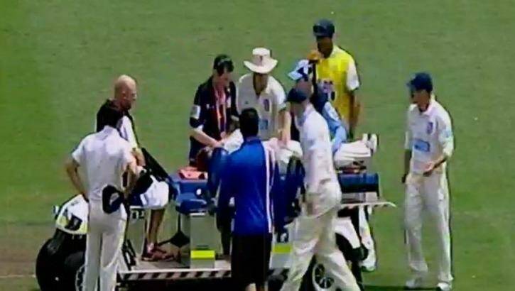 Phil Hughes is stretchered off the SCG.