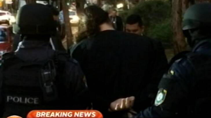 Five people have been arrested after terror raids in Sydney's west. Photo: Channel Nine