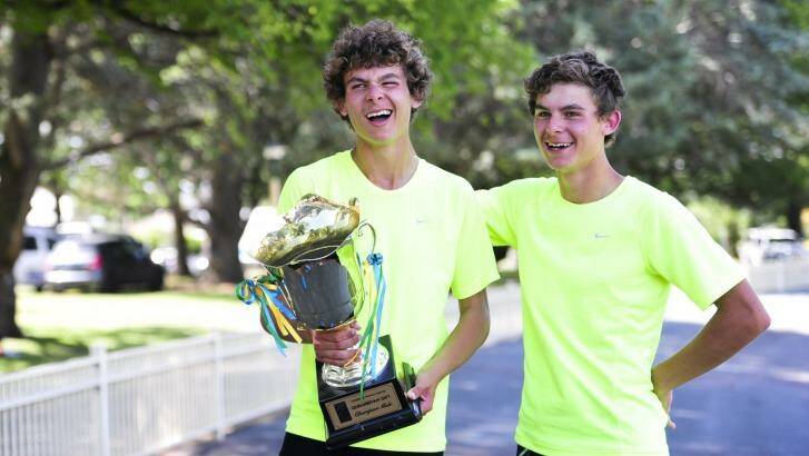 Thomas Newman (with trophy) and his identical twin Jack finished first and second in the Queanbeyan Gift.  Photo: Melissa Adams