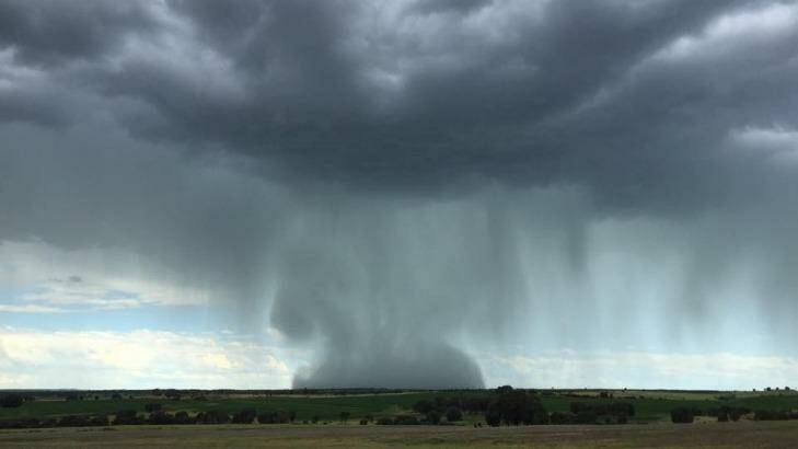 Cloud burst drops like a water bomb. Photo: Peter Thompson, via Higgins Storm Chasing