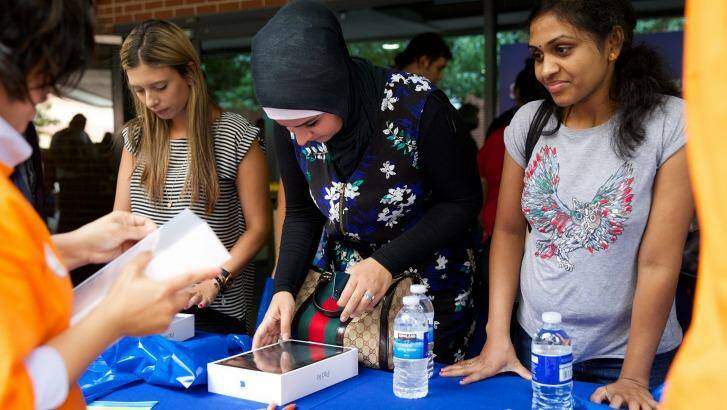 Students who have already agreed to study at the University of Western Sydney flocked to the Parramatta campus on Tuesday to collect their free $500 iPad. Photo: Wolter Peeters