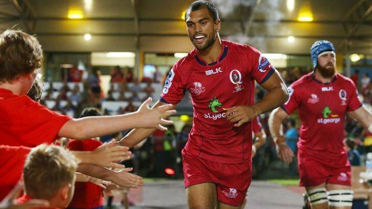 Karmichael Hunt of the Reds runs out in his return to rugby. Photo: Chris Hyde