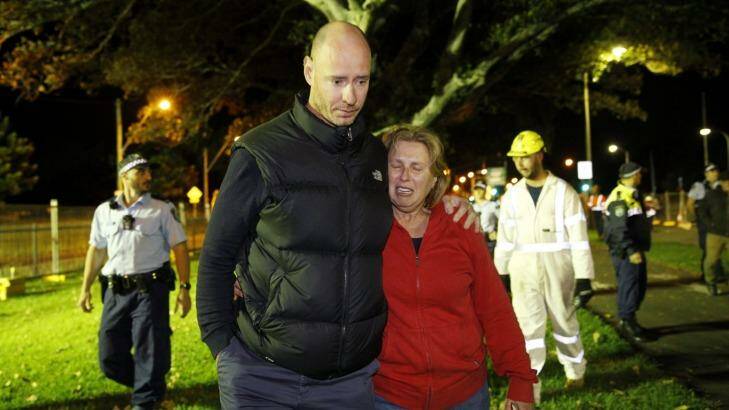 Greg Vankuyk and Sharon Bowen leave the enclosure after protesting
against the destruction of more Moreton Bay Fig trees on Anzac Parade. Photo: Janie Barrett