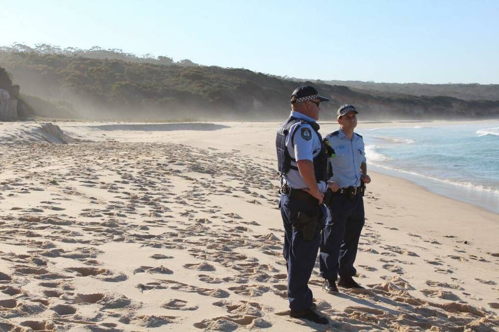 Police at Terrace Beach, where a sand dune collapsed on 10-year-old Byron Gordon on Monday.  Photo: Amanda Stroud