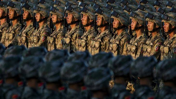Chinese soldiers march past Tiananmen Square. Photo: Kevin Frayer