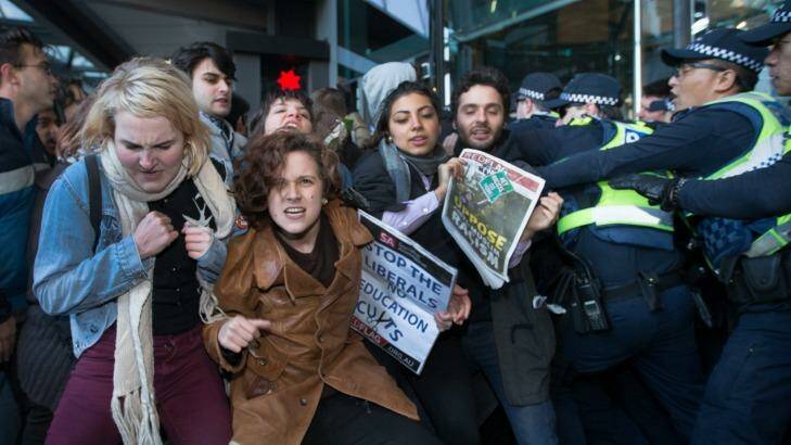 Demonstrators clash with police outside NAB headquarters in Melbourne's Docklands.  Photo: Simon Schluter