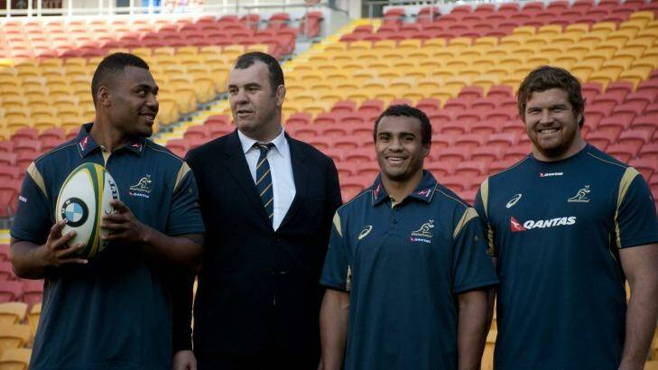 Awesome foursome: Samu Kerevi, Michael Cheika, Will Genia and Greg Holmes during the Australian Wallabies squad announcement in Brisbane. Photo: Robert Shakespeare