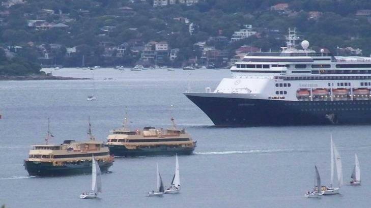 Sydney ferries Freshwater and Collaroy slowed as they passed the stationery cruise ship. Photo: Steve Tucker