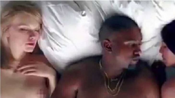 Kanye sleeping next to a Taylor Swift lookalike in the video Photo: YouTube
