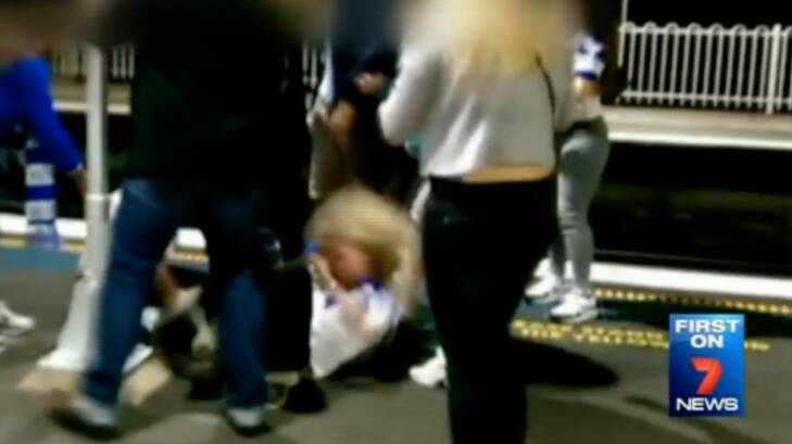 A woman, who was attacked on the platform, being kicked in the head. Photo: Seven News