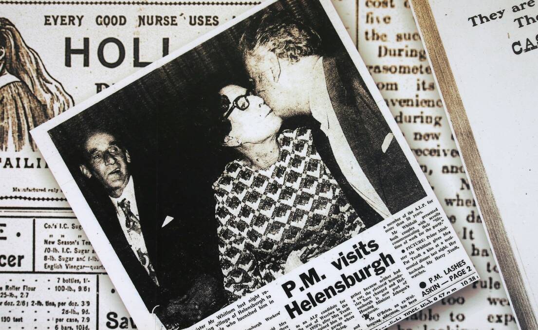 The clipping of former prime minister Gough Whitlam giving Helensbugh local Pat Teudt a kiss with husband Harry Teudt in the background. Picture: KIRK GILMOUR