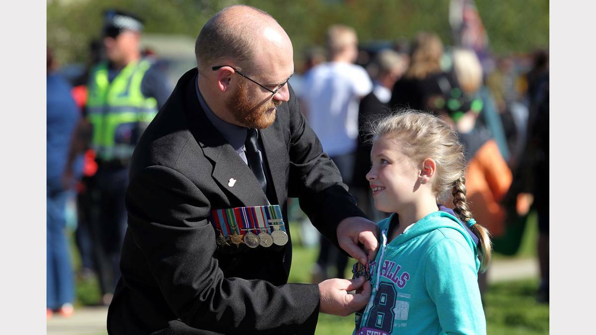 WODONGA: Dale Skinner from Wodonga and his daughter, Lily, 8 from Avenel, getting ready for the Anzac Day march. Photo: The Border Mail. 