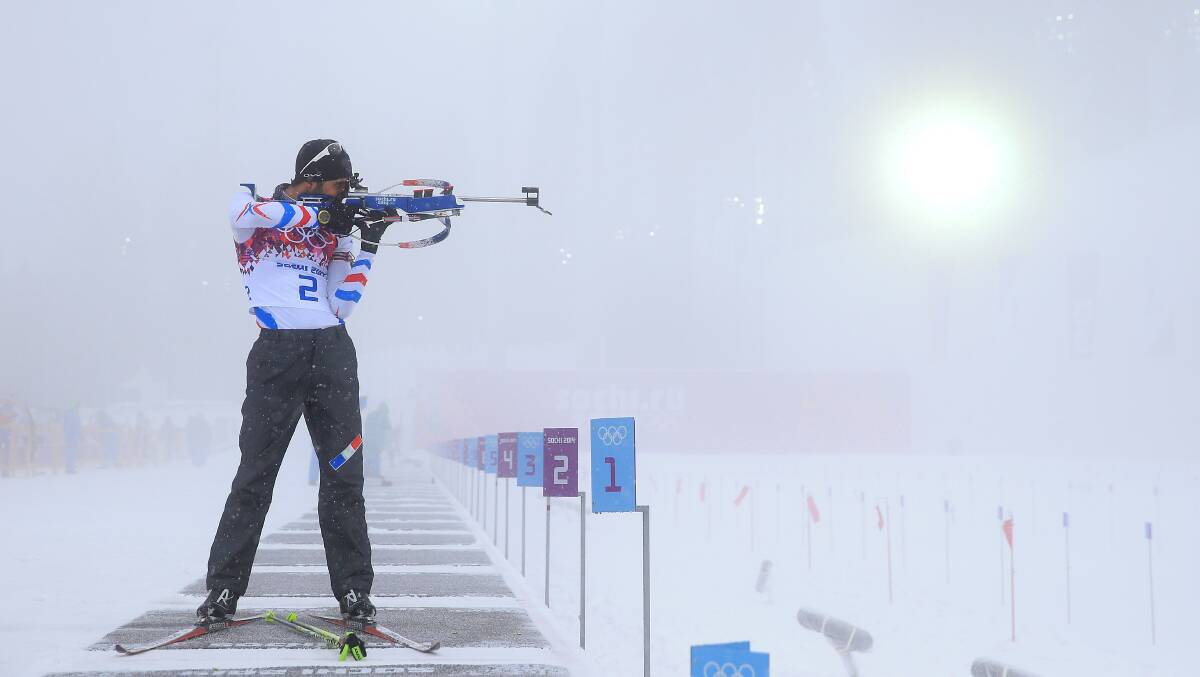Martin Fourcade of France practises at the shooting range in foggy conditions before the Men's 15 km Mass Start during day 11 of the Sochi 2014 Winter Olympics at Laura Cross-country Ski & Biathlon Center on February 18, 2014 in Sochi, Russia. Photo: GETTY IMAGES