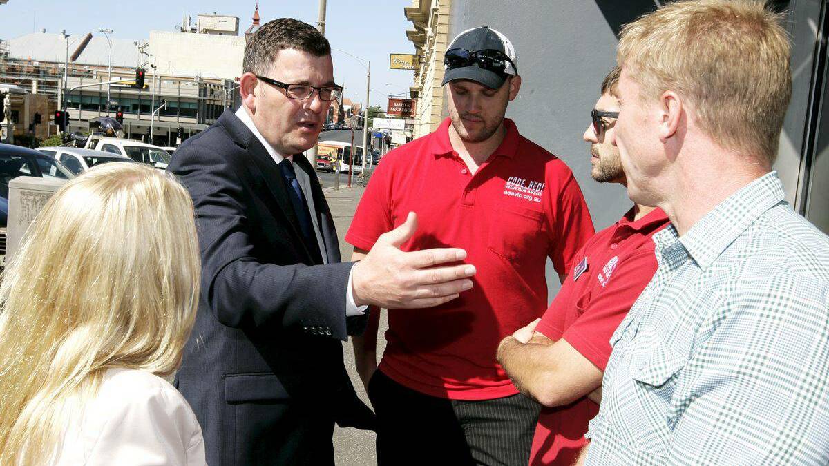 Strained relations: Sharon Knight and Daniel Andrews with paramedics Adam Phillips, Mitch Ridgway and Barry Brennan.