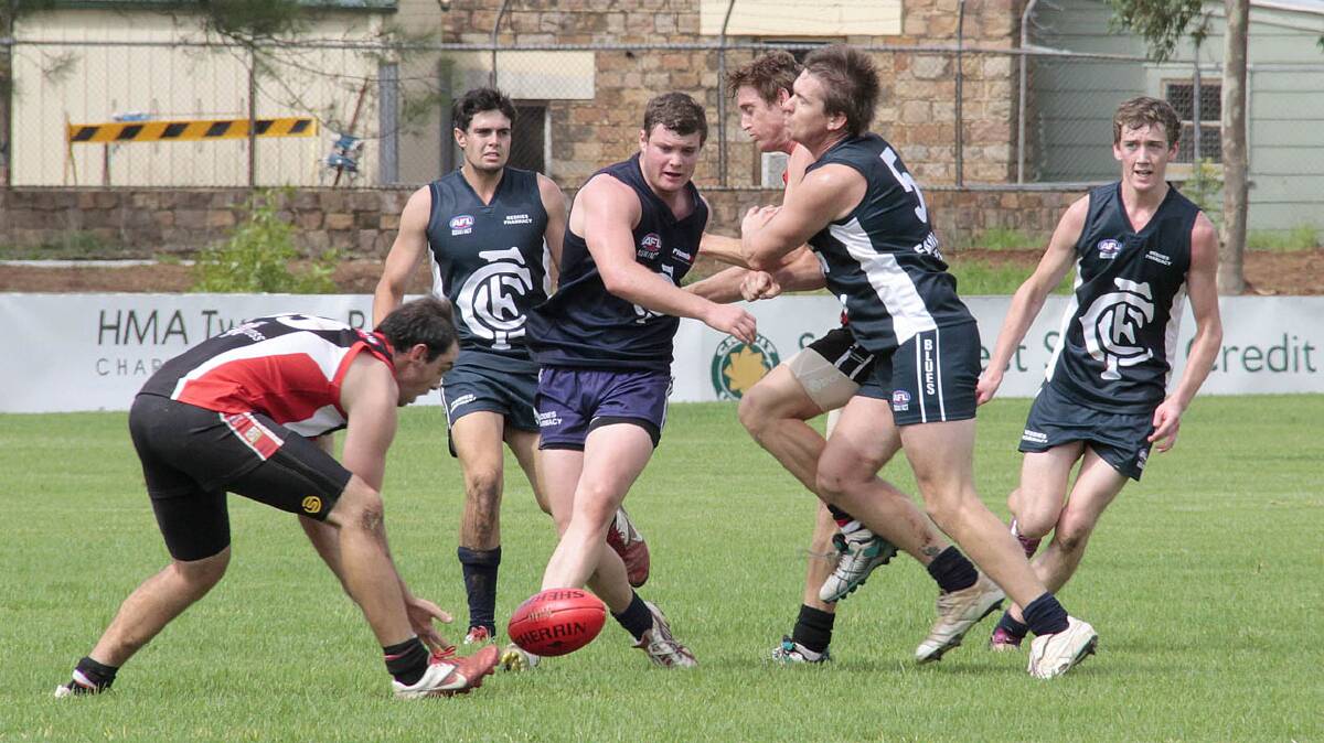 COOTAMUNDRA: Jordyn Ballard (second from left) goes for the ball while Blues captain Luke Webb (second from right) provides support. Also in the frame are Tom Cronin (far left) and Luke Johnson (far right).