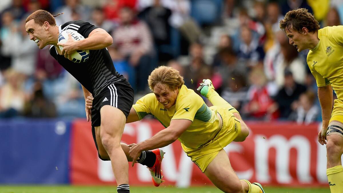 Joe Webster of New Zealand is tackled by Jesse Parahi of Australia. PICTURE: GETTY