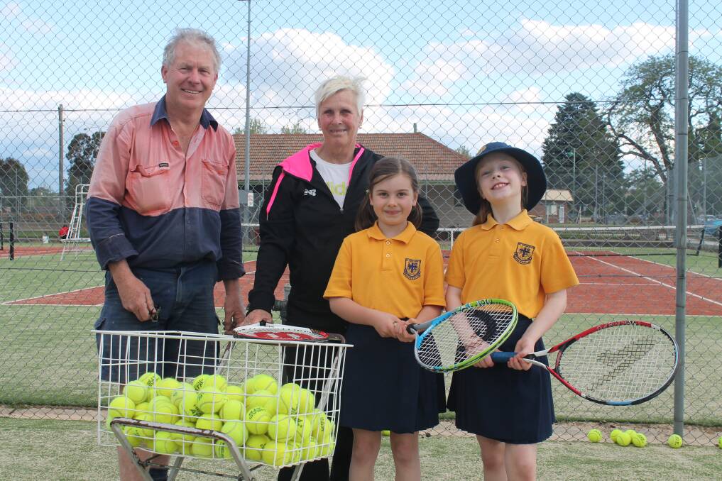 Queanbeyan Park Tennis Club president Andrew Schmocker with head coach Bronwyn Kitchener and students Katie Bissett and Rose Taylor. Photo: Joshua Matic.