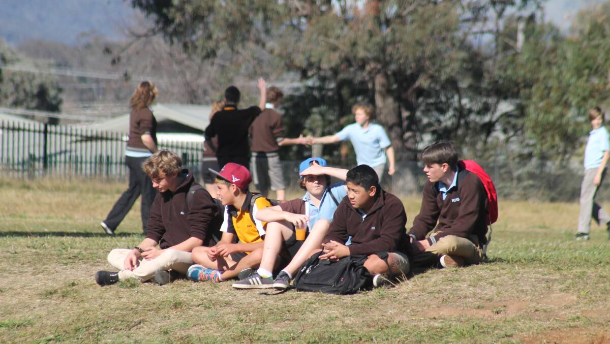Karabar High School students watch on from the sidelines.