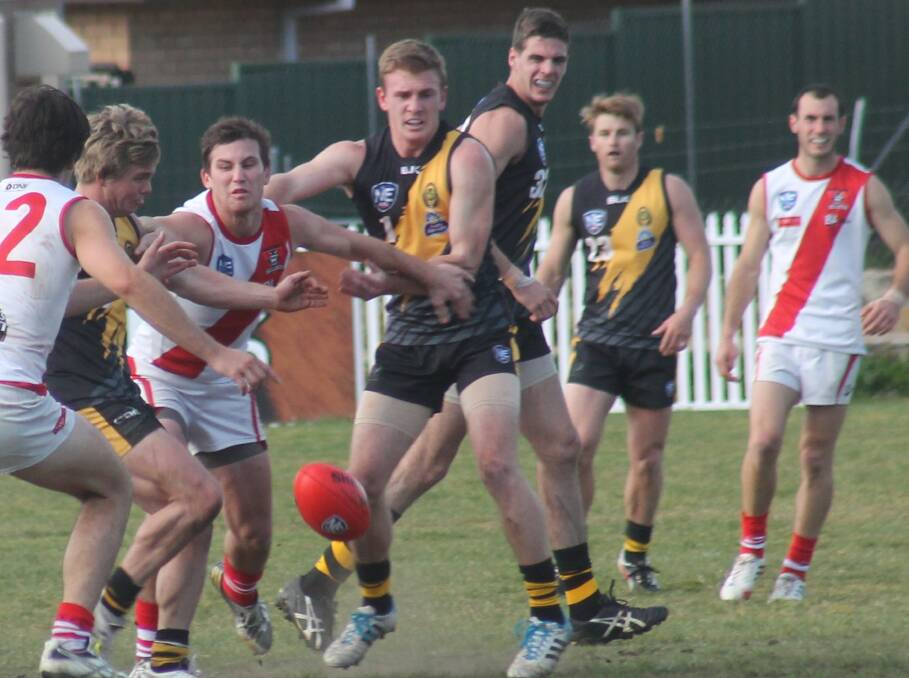 Queanbeyan Tigers NEAFL co-coach Kade Klemke in the middle of a ruck against Eastlake last month. Photo: Joshua Matic.
