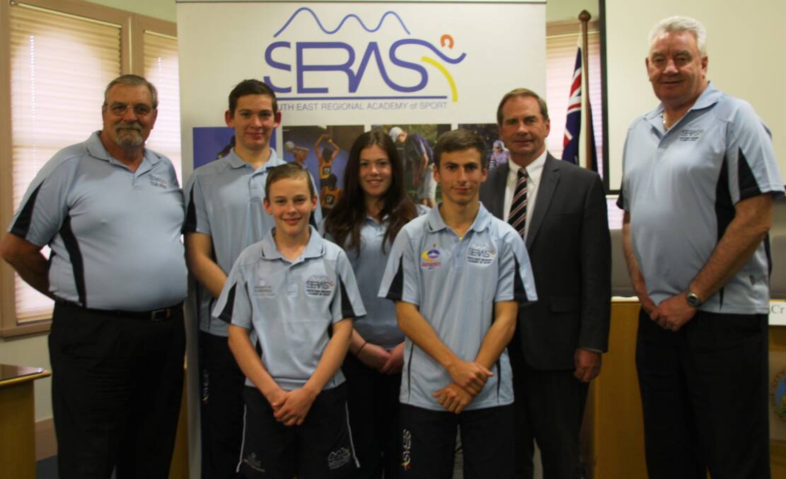 Queanbeyan athletes Ryan Martin, Eligh Unwin, Kathryn Martin and Daniel Arroyo receive their scholarships from mayor Tim Overall and SERAS directors Mick Mayhew (far left) and Goff King (far right).