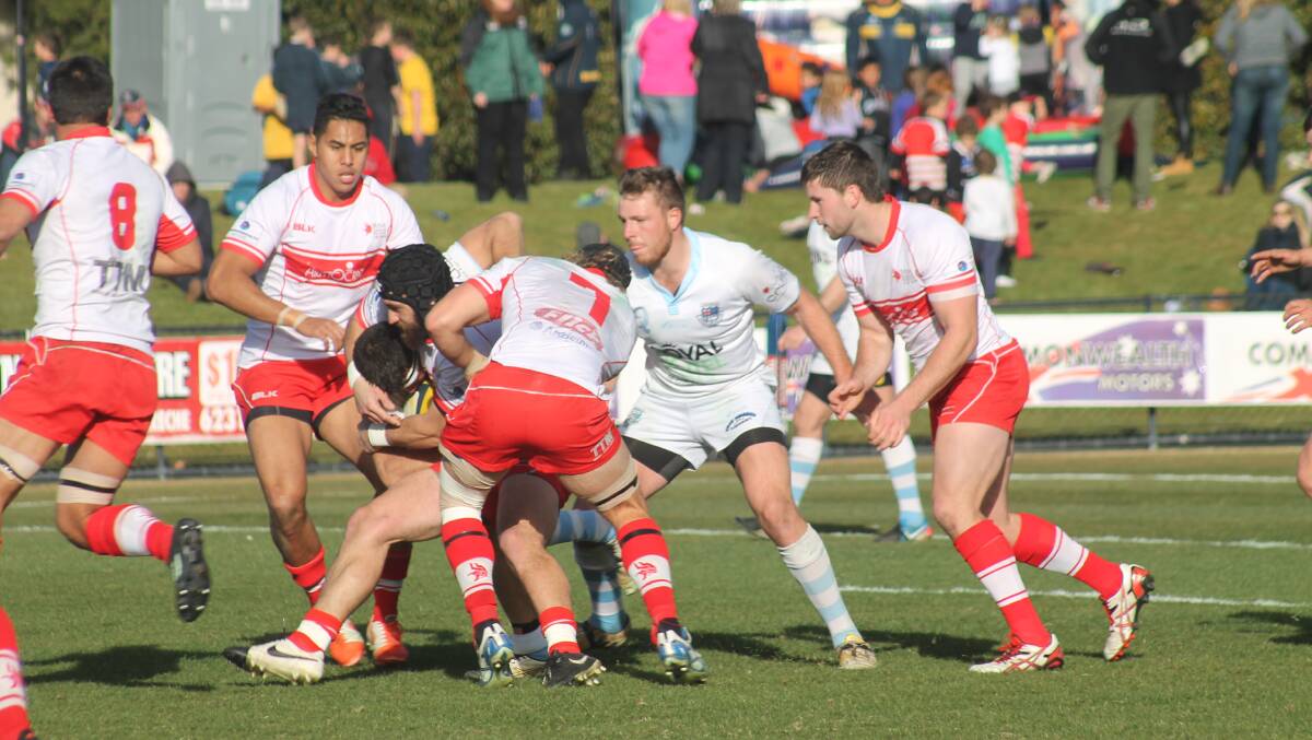 The Queanbeyan Whites in action against the Tuggeranong Vikings in the John I Dent Cup grand final at Viking Park on Saturday. Photo: Joshua Matic.