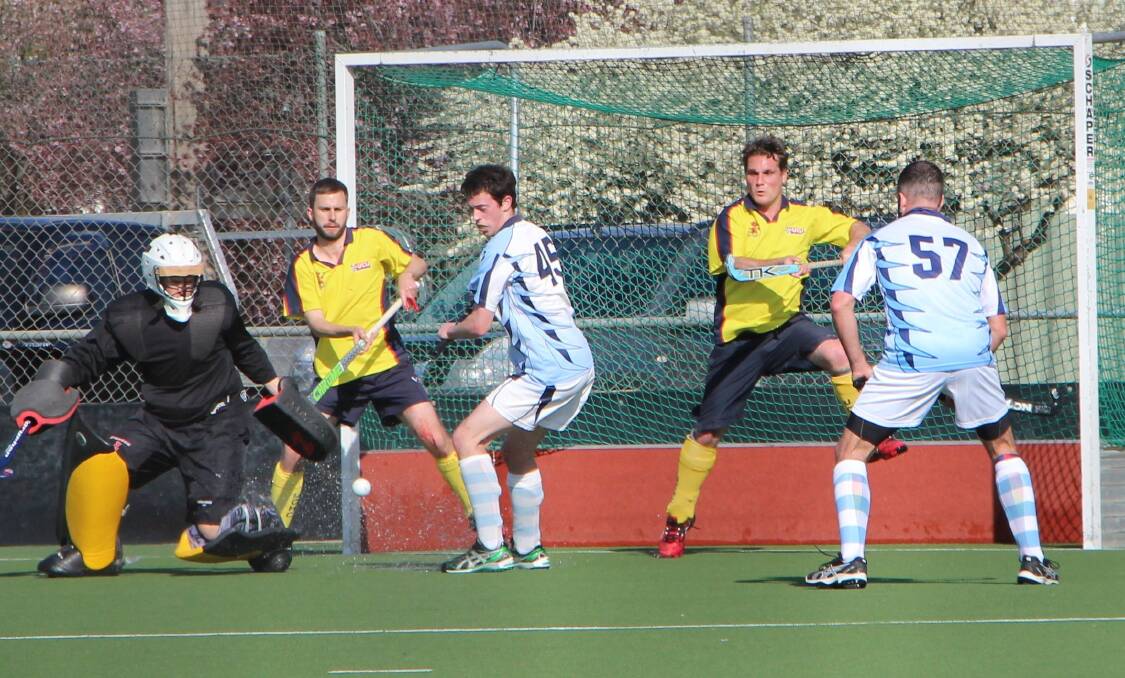 Queanbeyan Hockey players in preliminary final action last weekend. Photo: Miles Thompson.