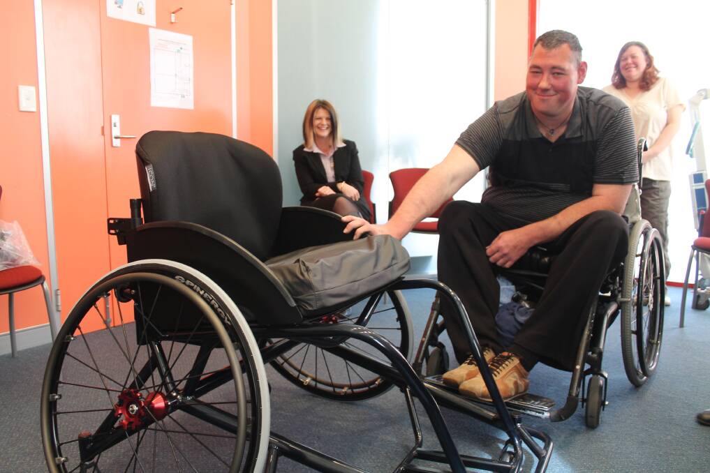 Queanbeyan former Paralympian Murray Goldfinch with his new sports wheelchair. Photo: Joshua Matic.