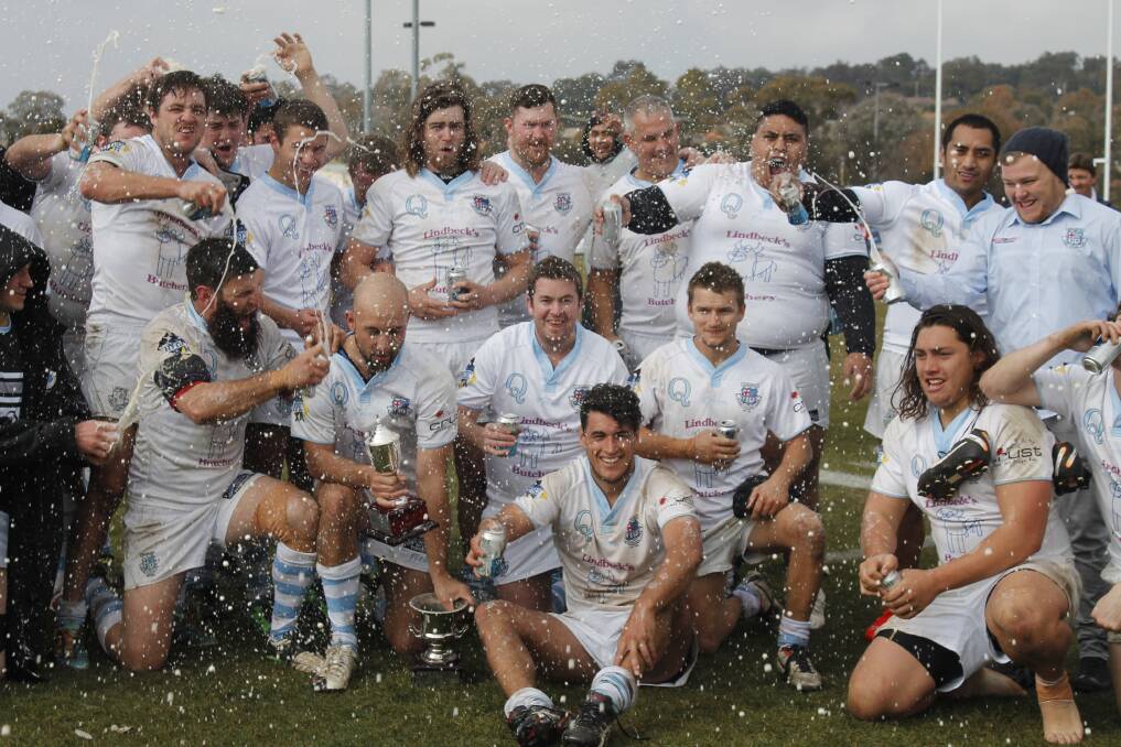The Queanbeyan Whites fourth grade side celebrates their 37-22 grand final win over the Tuggeranong Vikings at Viking Park last Saturday. Photo: Joshua Matic.