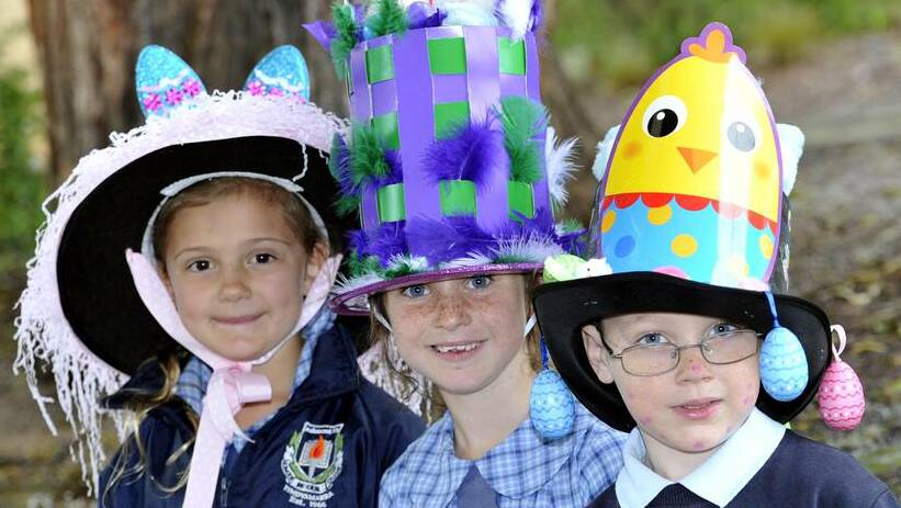 WAGGA WAGGA: Tyra Lawrence, Kaelin Lyons and Zane Manns, all 7, at the Ashmont Public School Easter hat parade. Photo: Kieren L Tilly/The Daily Advertiser.
