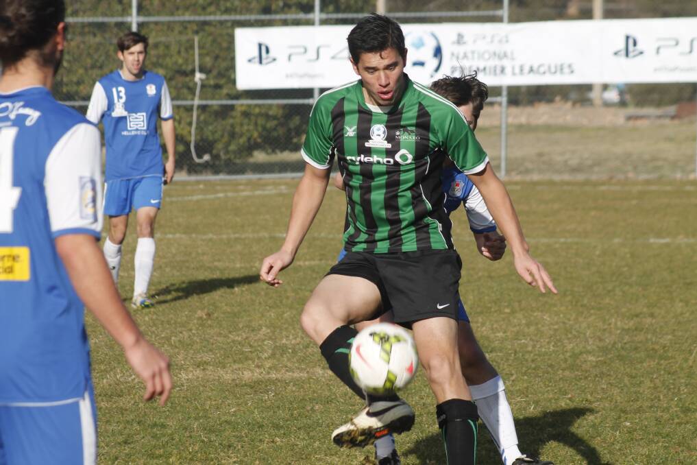 Panthers' Mark Shields works his way around the defender in their 4-0 loss to Canberra Olympic. Photo: Steph Konatar.