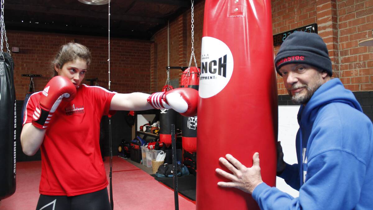 Ella Oakley and her dad Rob training for the Fight Night Experience at Gym Victus. Photo: Steph Konatar.
