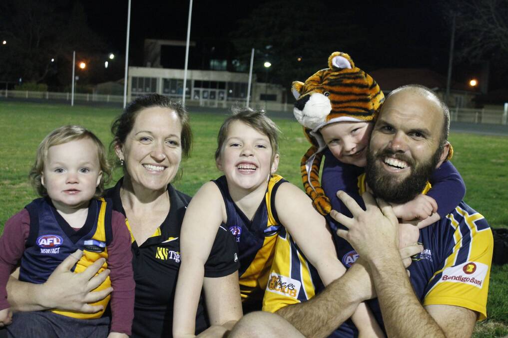 Tigerettes' Jacinta Froud and husband Aaron of the Harman Hogs will both play in grand finals this weekend supported by their children Claudia, 18 months, Eve, 6 and Blake, 4. Photo: Steph Konatar.