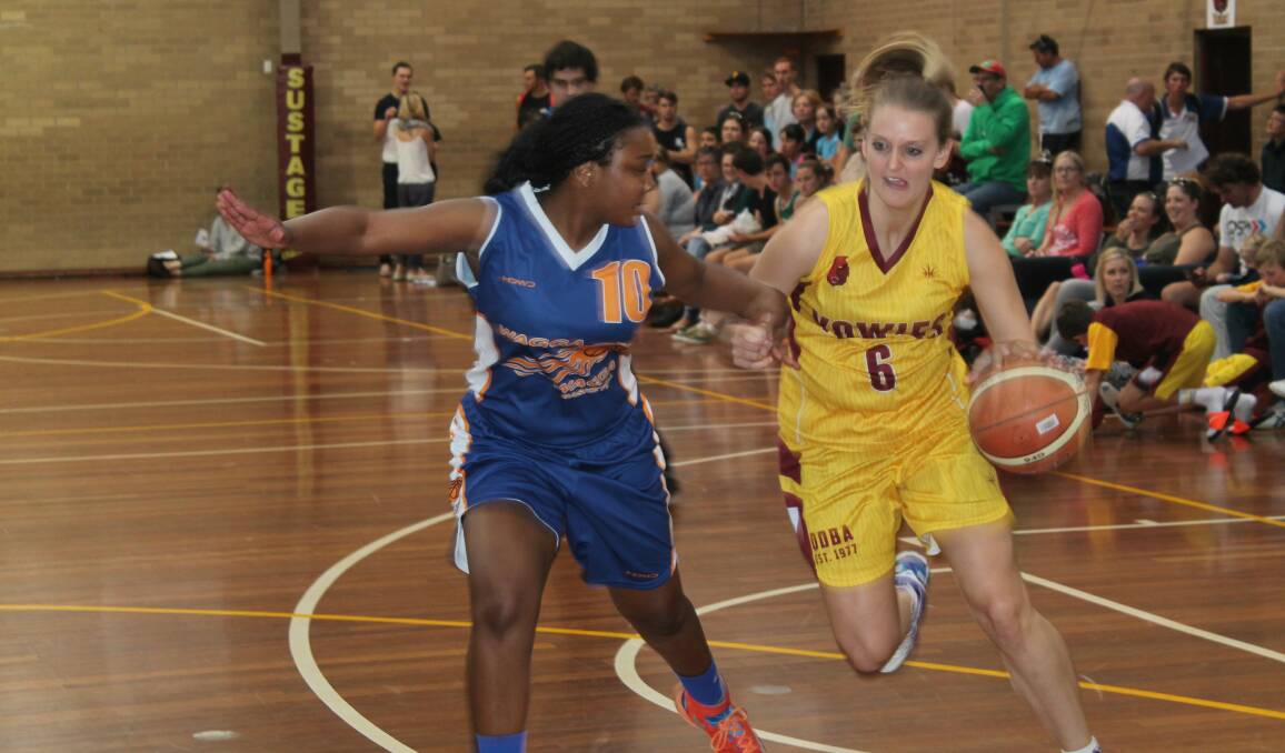 Yowies Hayley Douglas drives hard to the basket in the Yowies win against Wagga. Photo: Steph Konatar.
