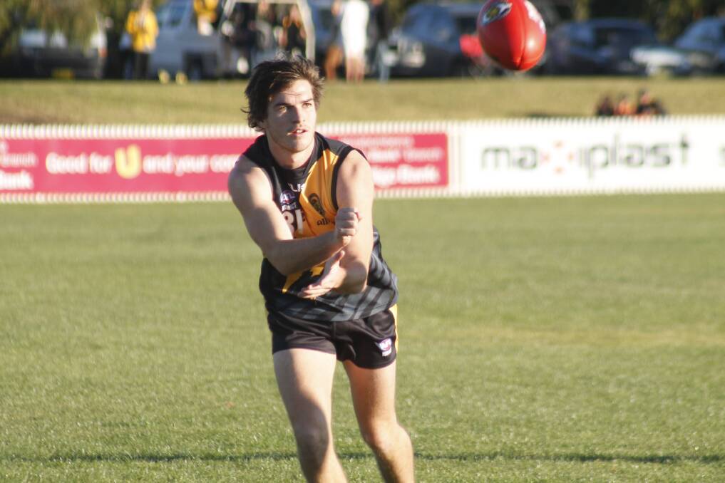 Mitch Price was instrumental in the Tiger's 25-point win over Gungahlin on Saturday, pictured here feeding out a handpass earlier in the year. Photo: Steph Konatar.