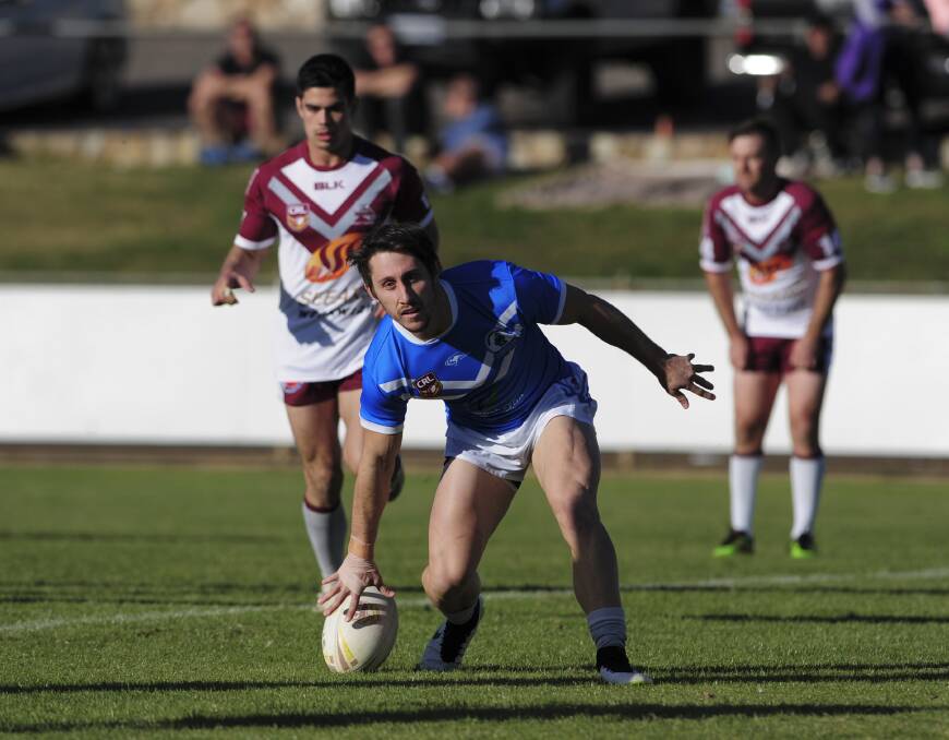 The Blues Tyler Stevens scores a try in their 34-18 win over the Roos. Photo: Graham Tidy, The Canberra Times.