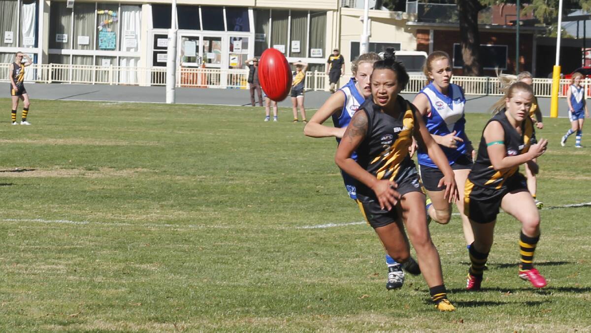 The Tigerettes Lani Watson was handy in the forward line in the girls 49-point belting of ANU. Photo: Steph Konatar.