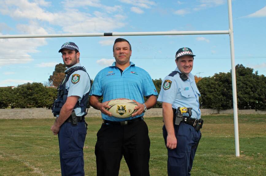 Queanbeyan Police officers Troy Bartlett and Kevin Shepherd and a team of local police officers will go head-to-head against Malcolm Towney (centre) and the indigenous community team 'All but one' in next week's Community Challenge Reconciliation Cup touch football match at Karabar High School 
Photo: Joshua Matic.