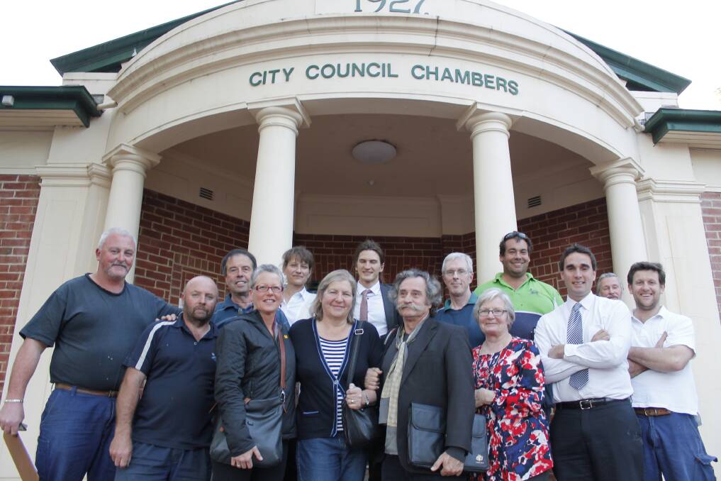 Ratepayers and Councillor Jamie Cregan gathered outside Council chambers last night to celebrate their rates win.