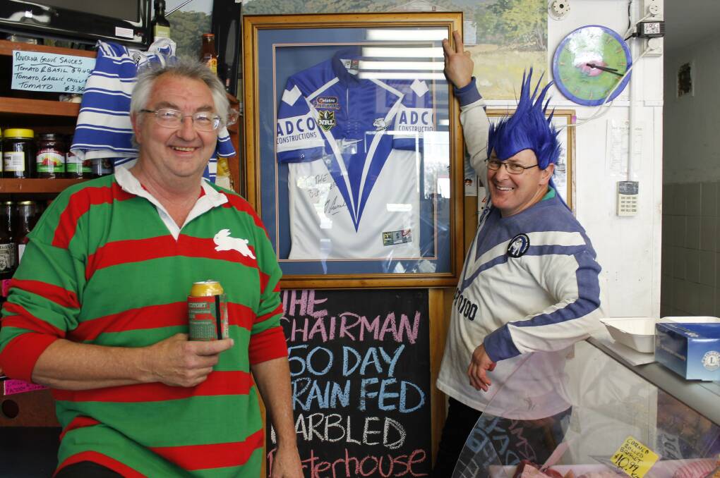 Rabid Rabbitohs supporter Frank Bresnik (left) and bullish Bulldogs supporter Peter 'Butcher' Lindbeck get into the competitive spirit ahead of Sunday's NRL Grand Final.
