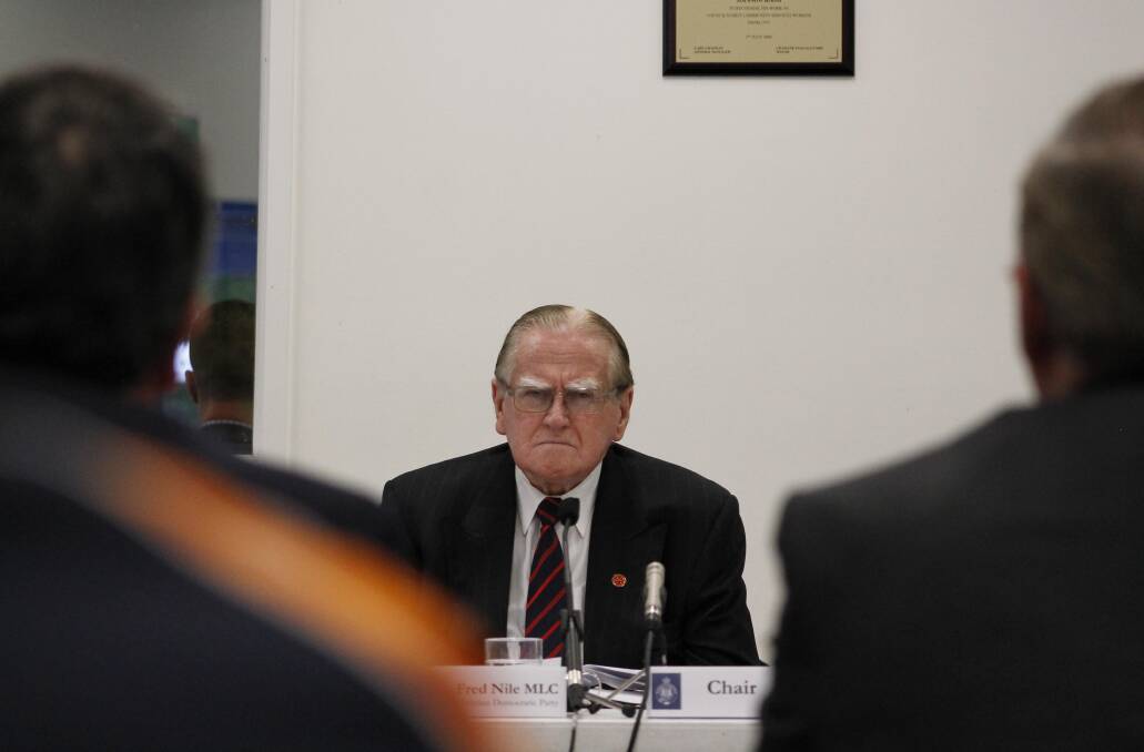 The reverend Fred Nile chairing Monday's loose fill asbestos inquiry in Queanbeyan.
