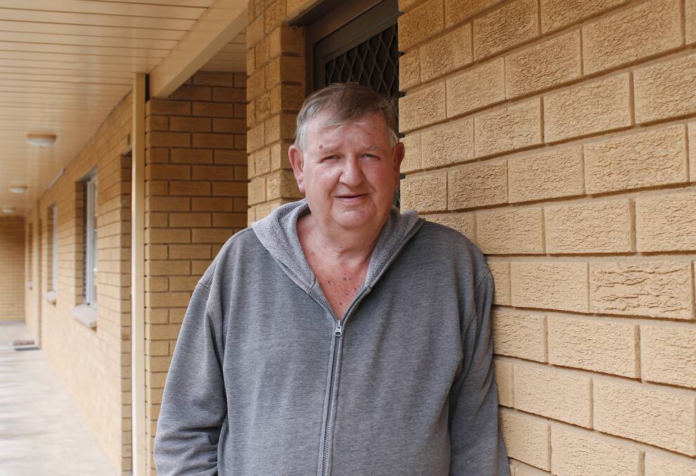 Queanbeyan resident John Braakman is a resident of Queanbeyan's only identified multi-unit block containing loose-fill asbestos.