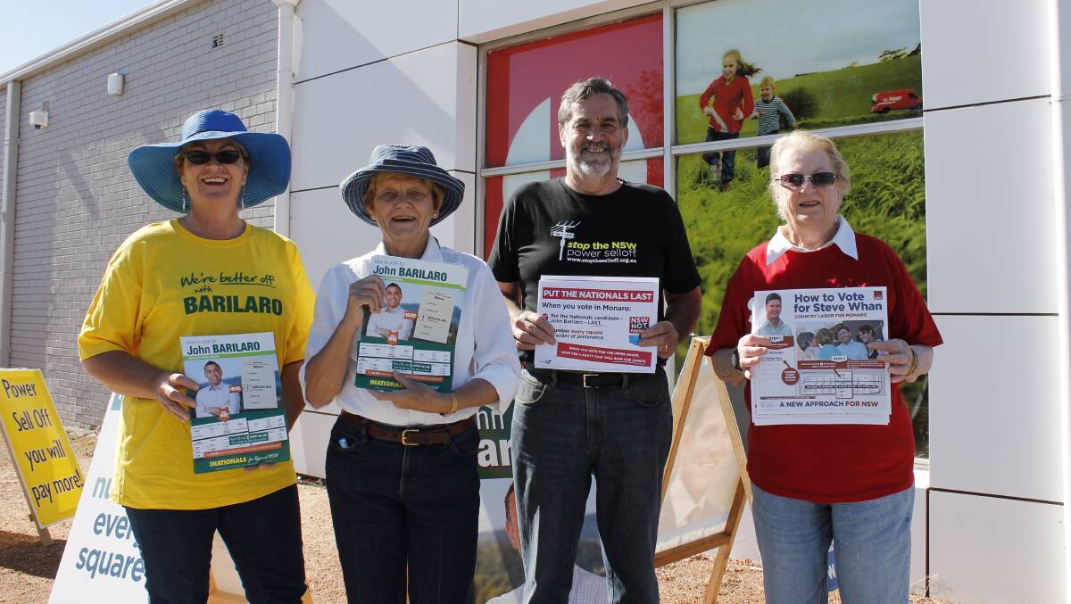 Monaro residents Maureen Bennetts, Sue Jarvis, Ray Seymour and Jil Chapman hand out how-to-vote cards at the Monaro St pre-polling booth.