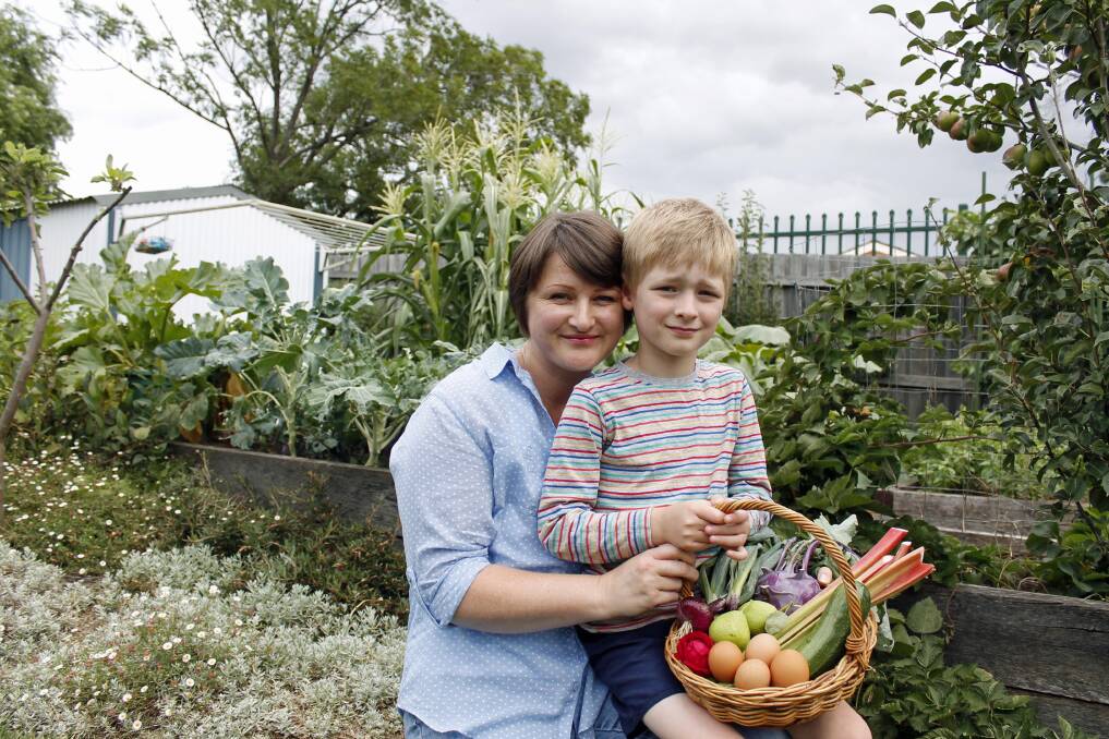 Em Callaghan and her son Harry with some of the summer produce from their garden (Photo: David Butler).