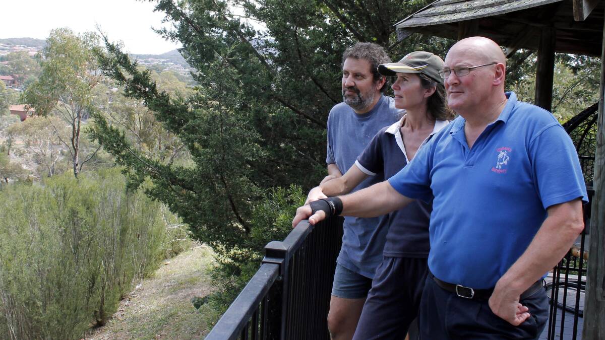 Greenleigh residents Peter Lindbeck (right) and couple Peter Kontis and Claire Cooper look over the Queanbeyan River Corridor where the EDE bridge is proposed.