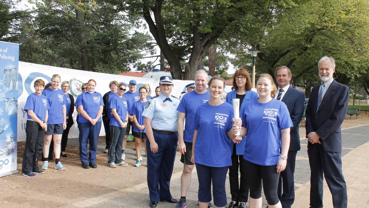 Snr. Const. Sarah Lawrence and Const. Deborah Hanson, backed by Inspector Denise Godden, Queanbeyan Superintendent Rod Smith, Queanbeyan's first police woman Irene Murray and mayors Tim Overall and Peter Harrison, with members of the Queanbeyan police force (Photo: David Butler).
