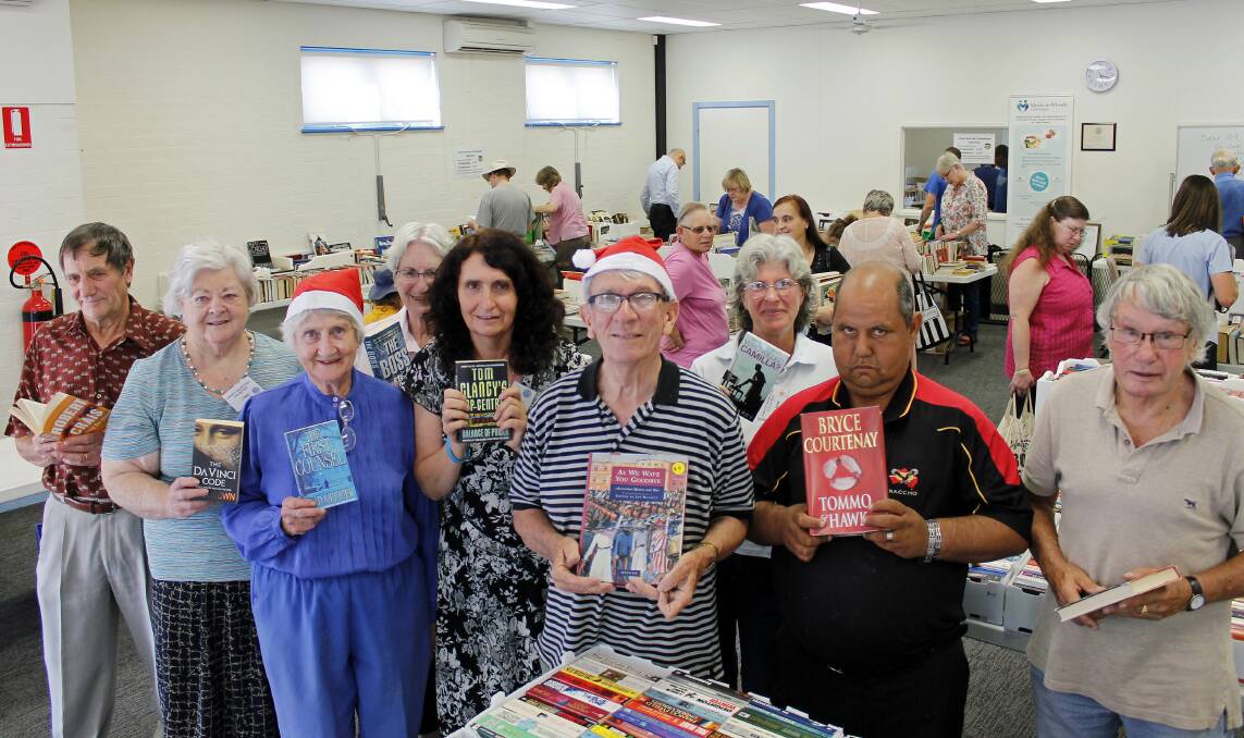 The Queanbeyan Charity Book Fair team: (from left) Alberto and Lynn Della Giustina, Shirley Edwards, Helen Hart,  Leah Milston, Peter Bray, Lynne Pearl, Lionel Williams and David Wallace.