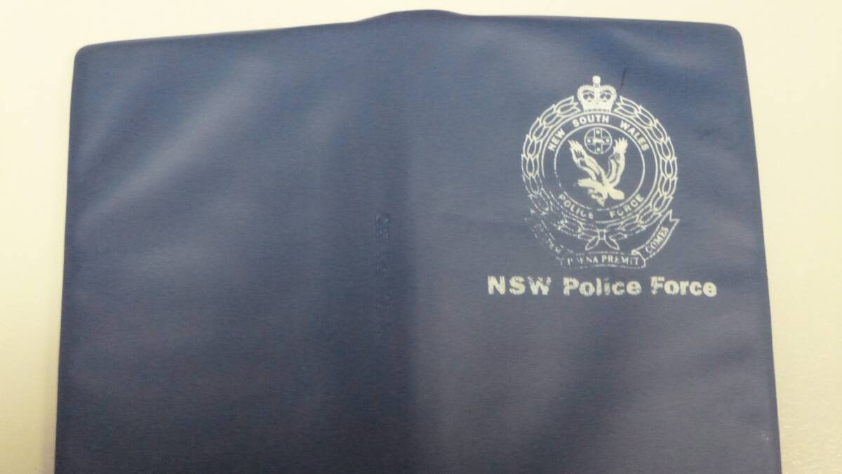 An example of a NSW Police-issued torch and Traffic Infringement Book that has been stolen in recent weeks. Police would like these items returned.
